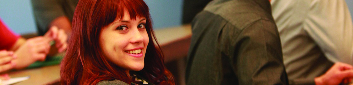 a young woman looks into the camera